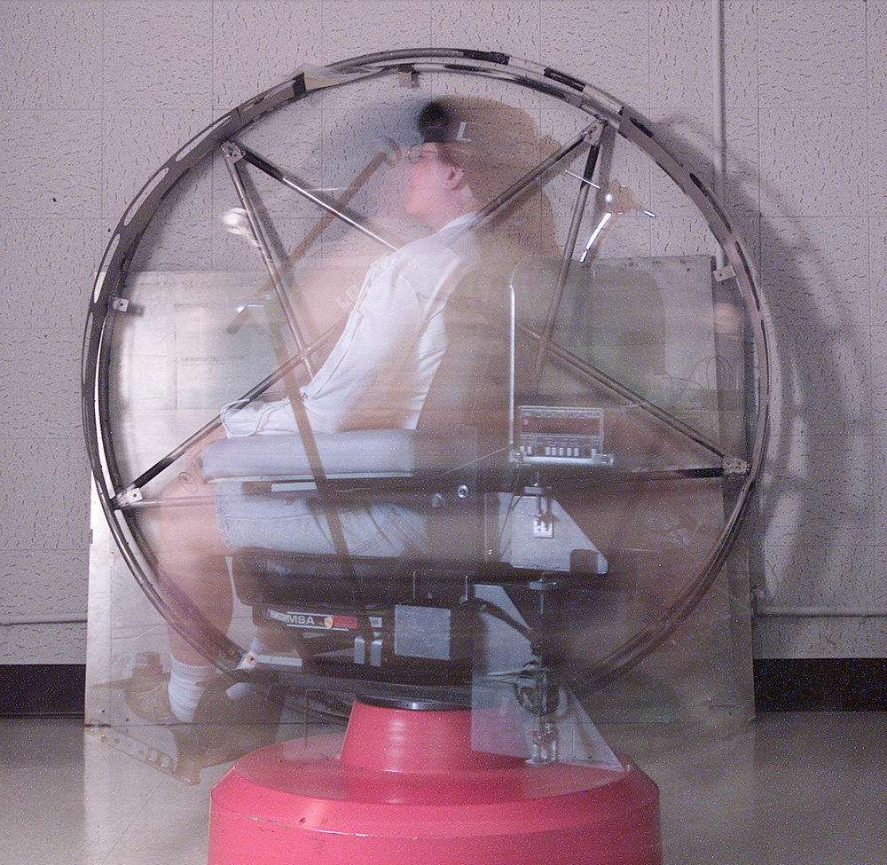 Image of the rotating chair at NASA Ames Research Center's Psychophysiology Research Lab. The chair is used to induce symptoms of motions sickness in research subjects.