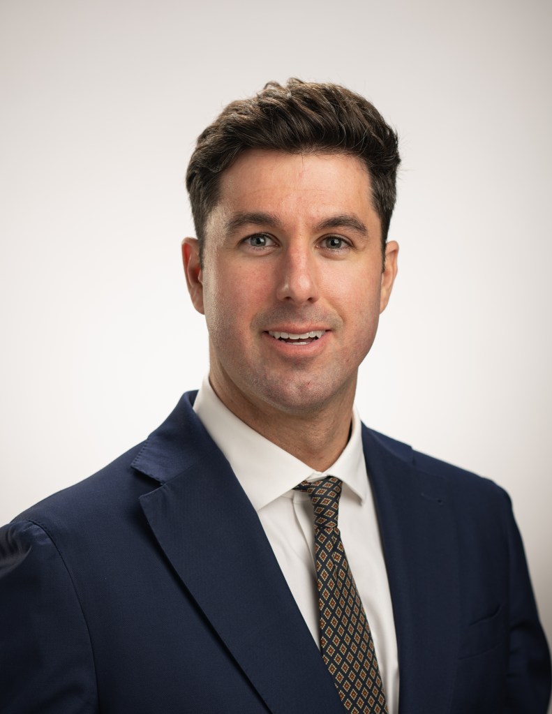 Studio portrait of Aaron McKinnon