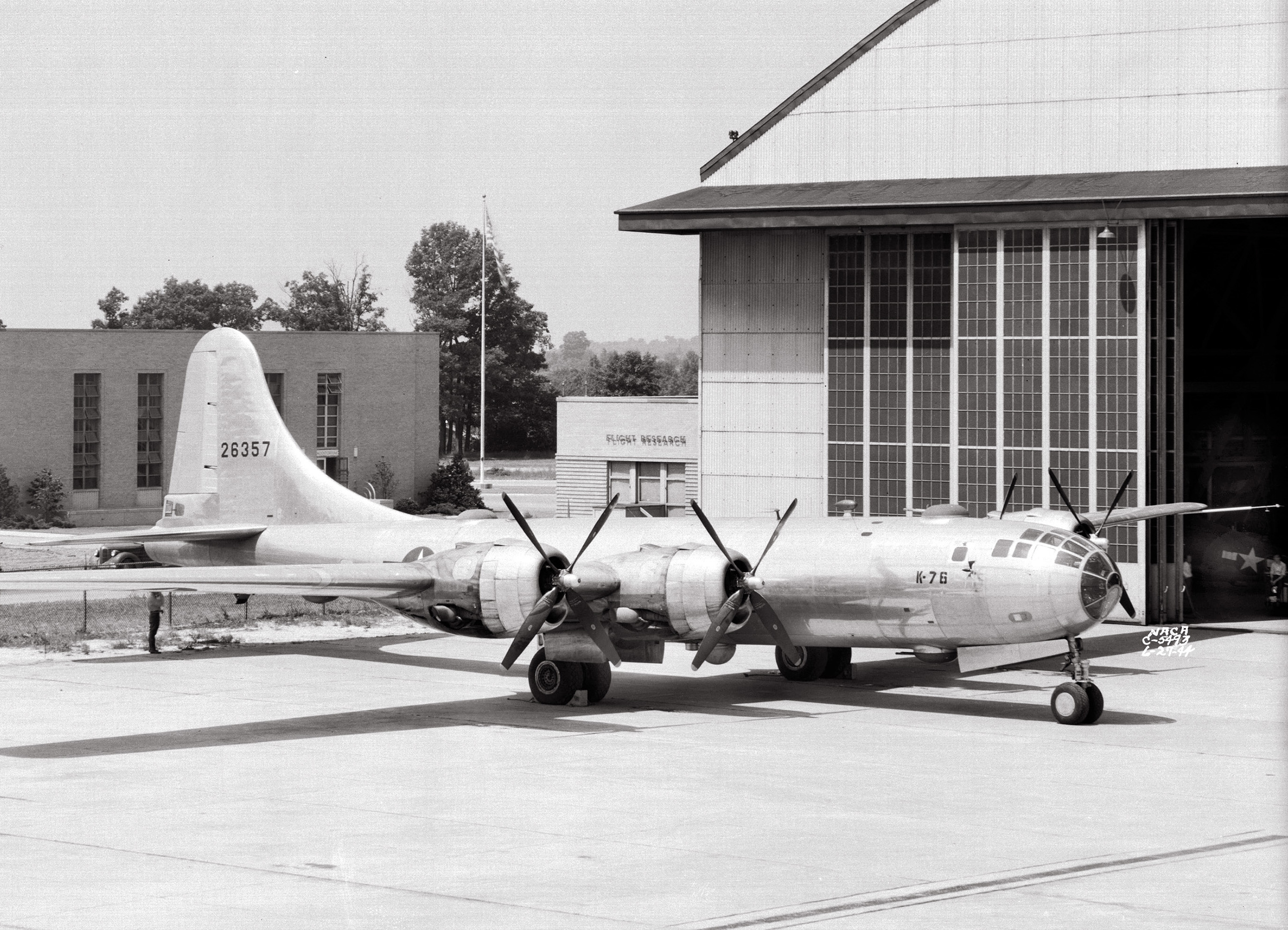 B-29 bomber on hangar apron