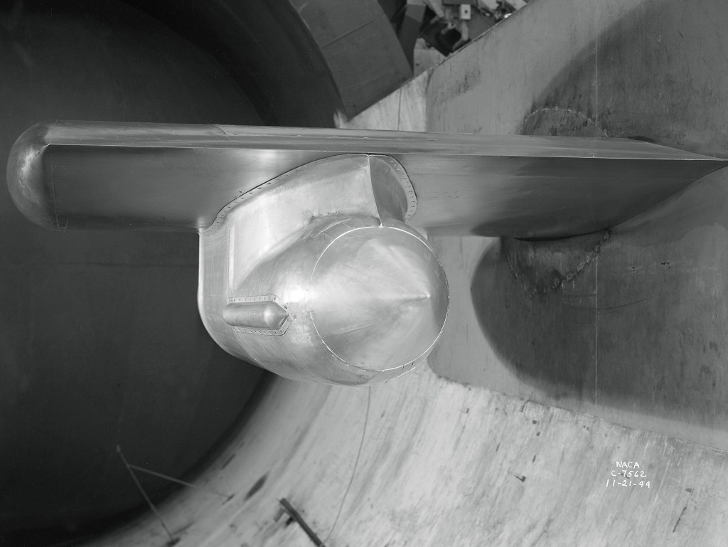 Westinghouse 19B model suspended from wing span in AWT test section.