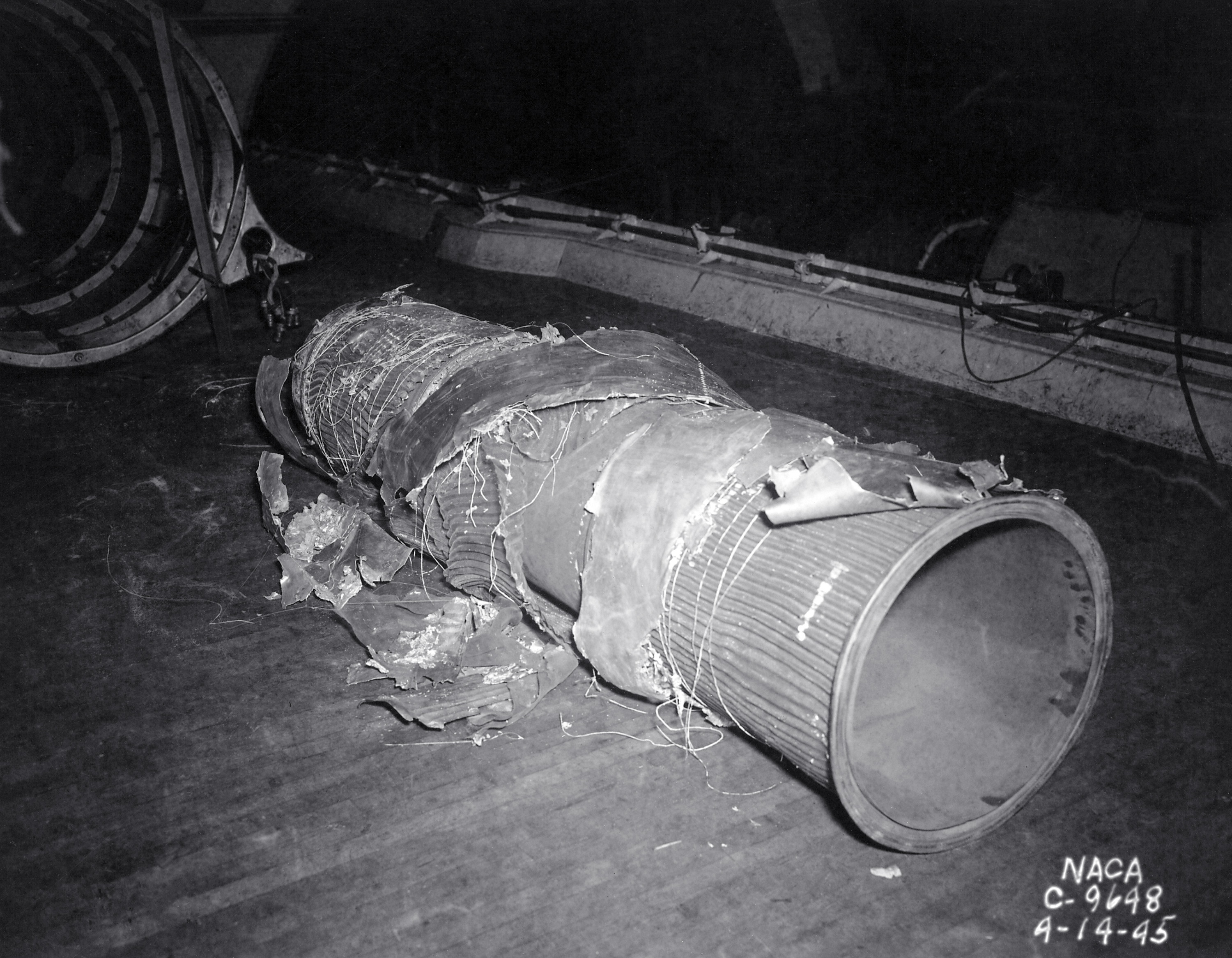 Damaged exhaust pipe lying on ground