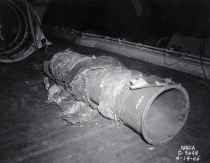 Damaged exhaust pipe lying on ground