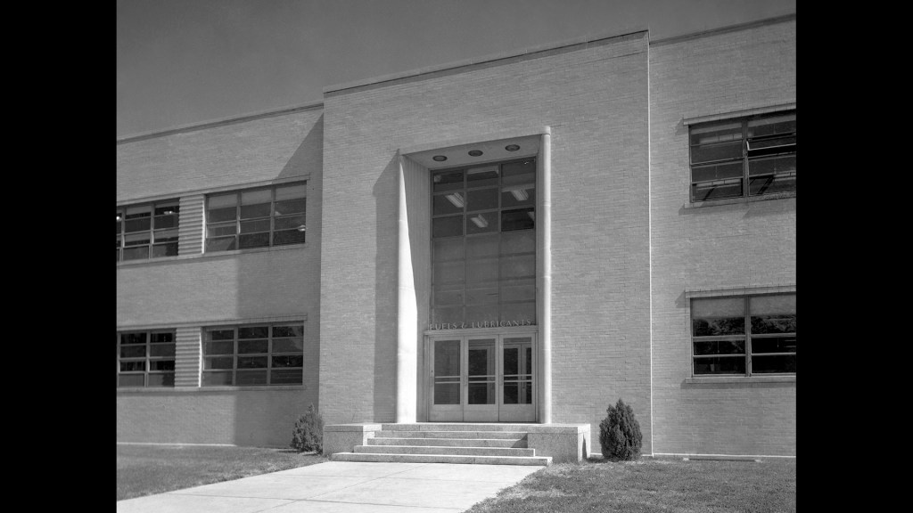 View of main entrance to brick building.