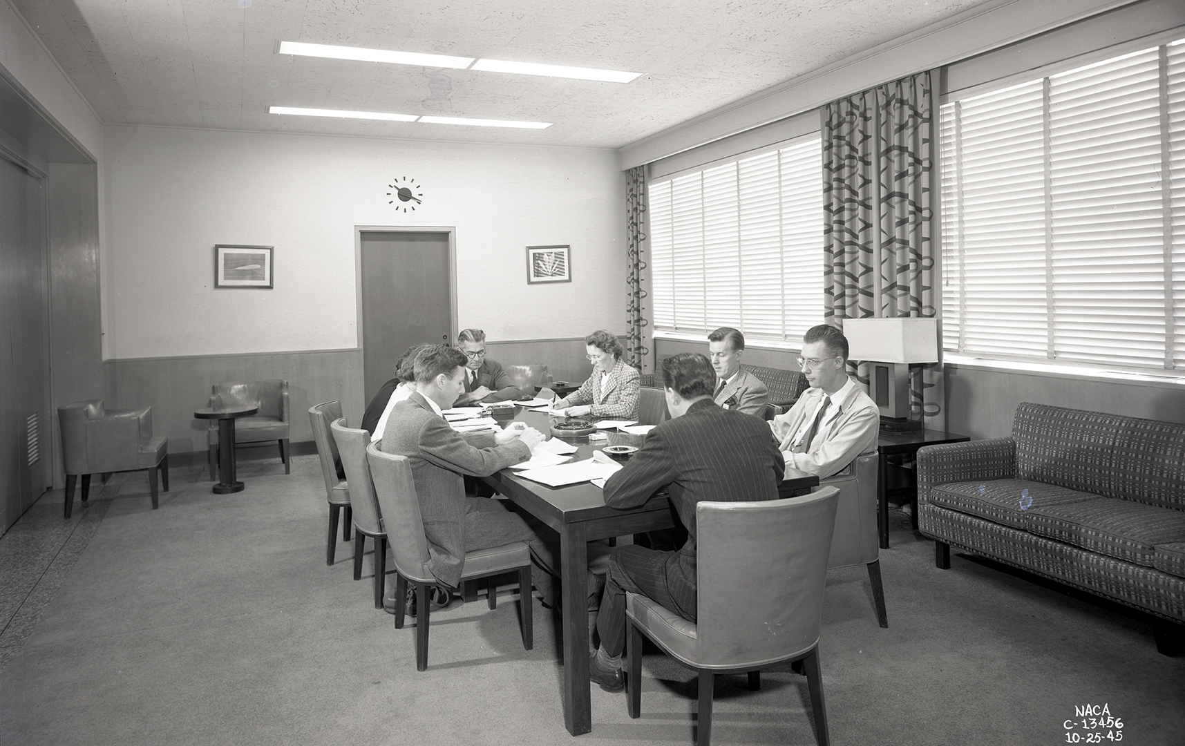 Group at table in conference room.