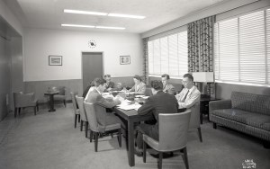 Group at table in conference room.