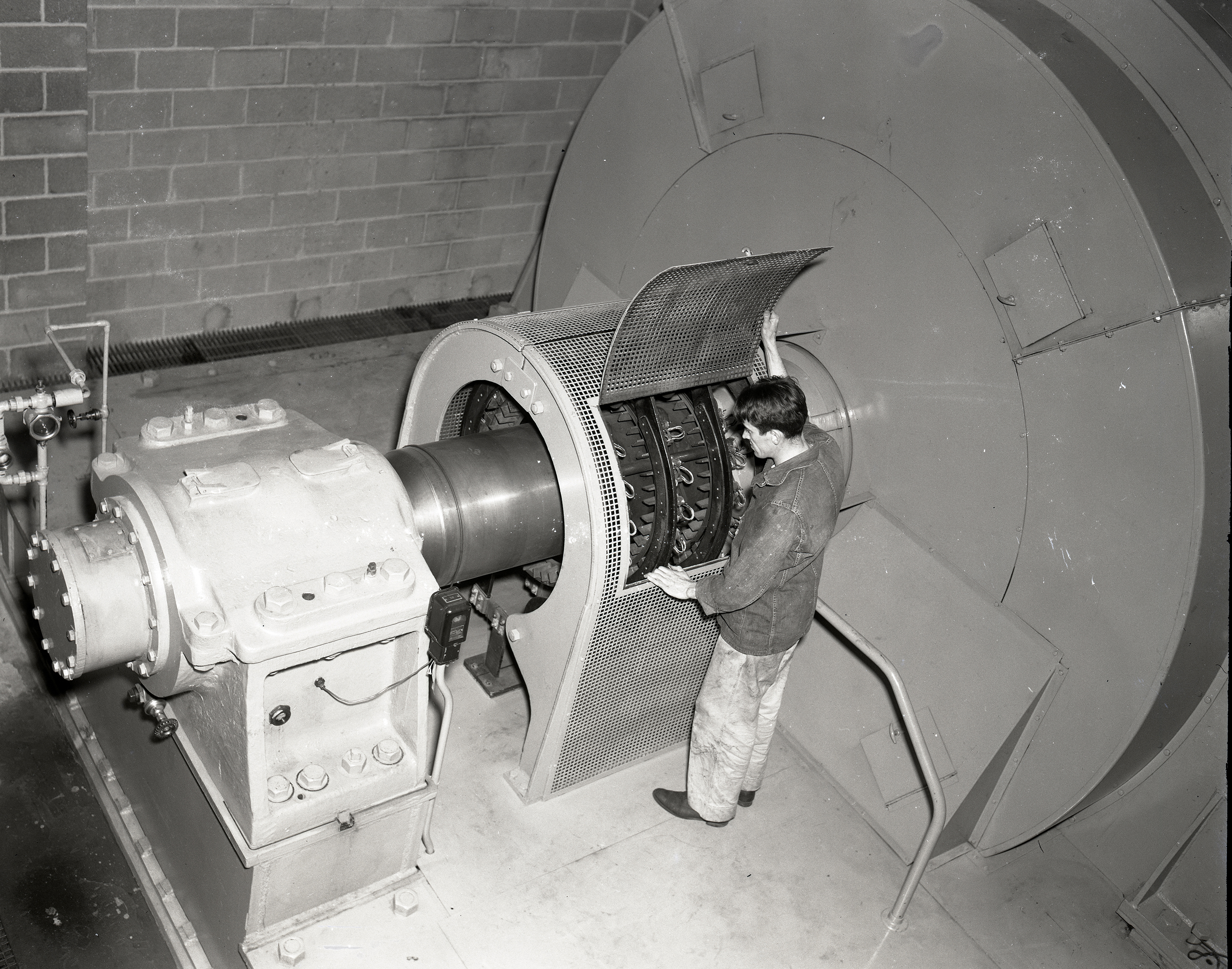 Technician examines drive motor