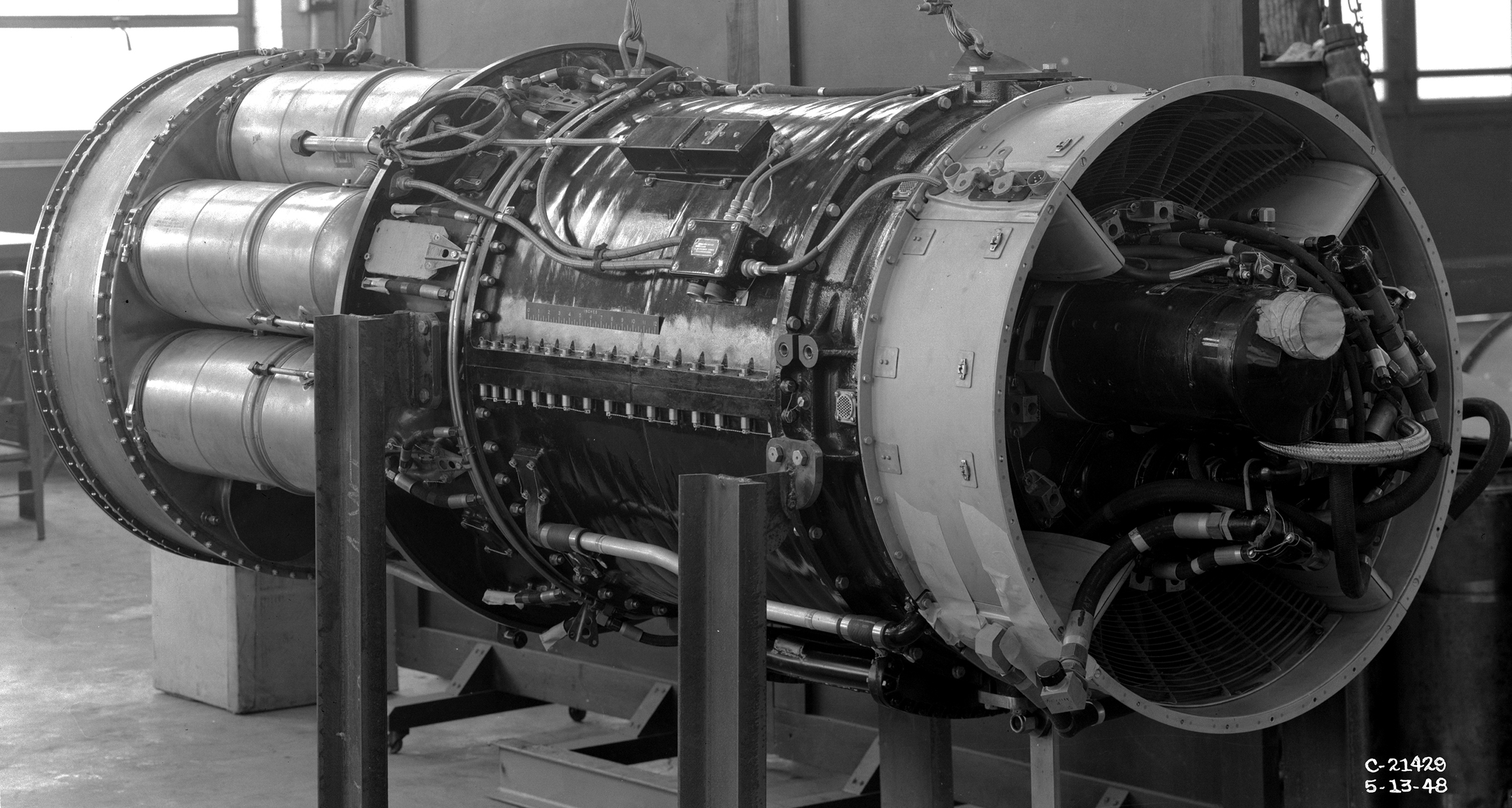 A TG-190 engine on stand in shop area.