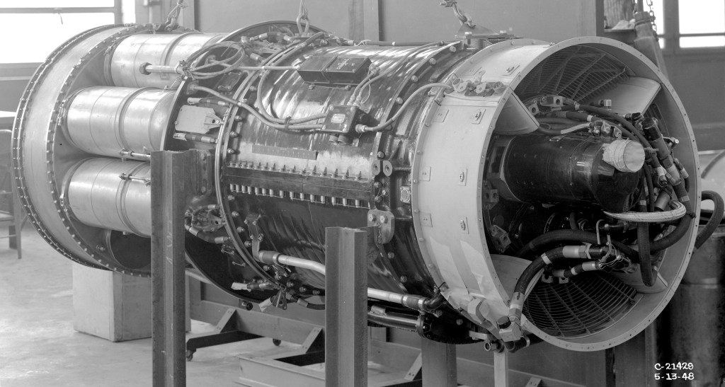 A TG-190 engine on stand in shop area.