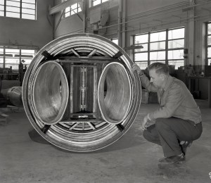 Man examining engine inlet duct.