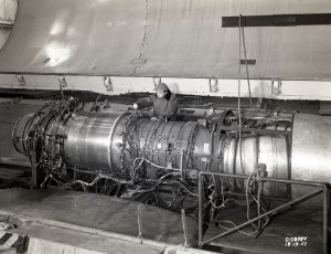 Mechanic with engine in test section.