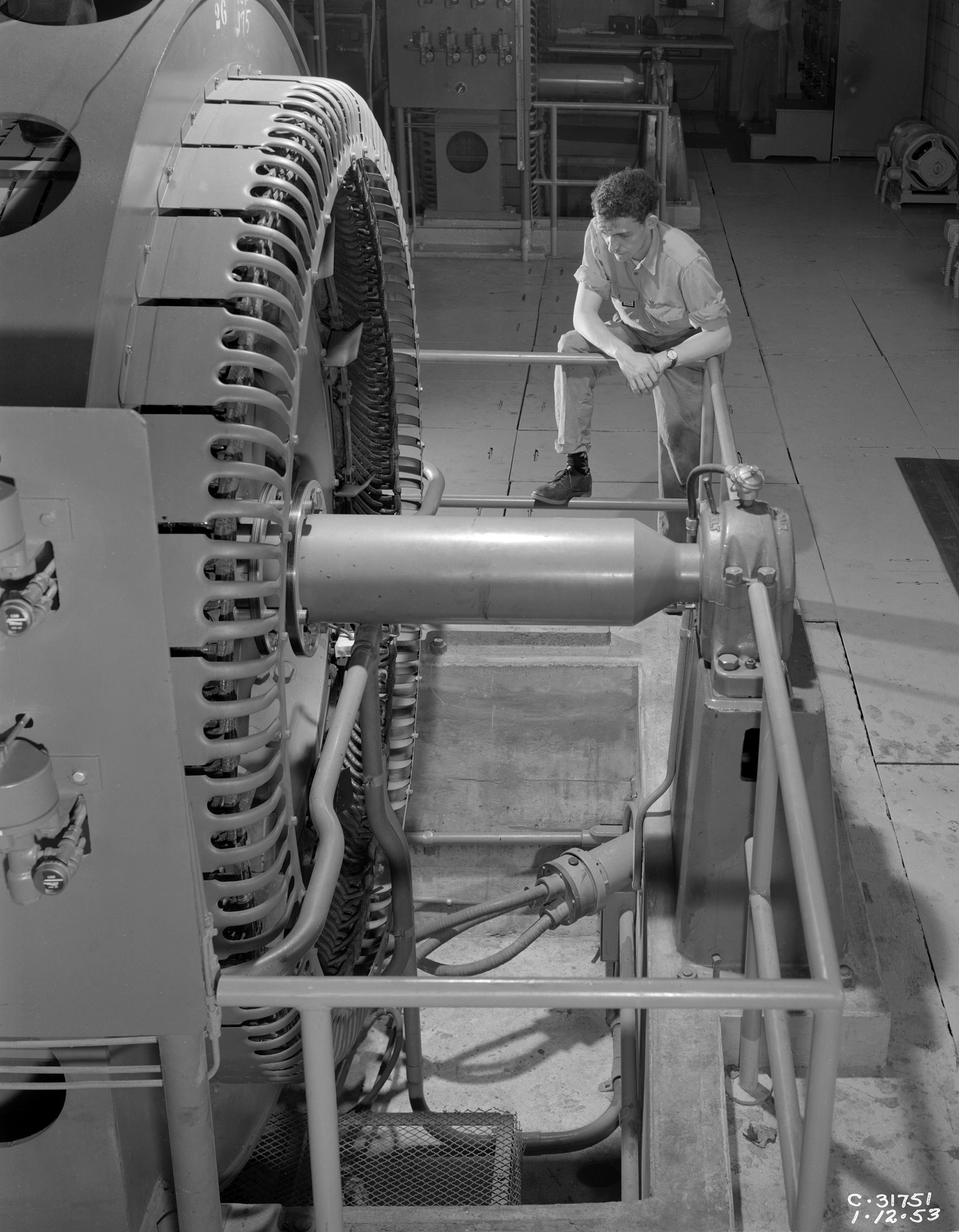 Technician with Compressor in Exhauster Building Addition