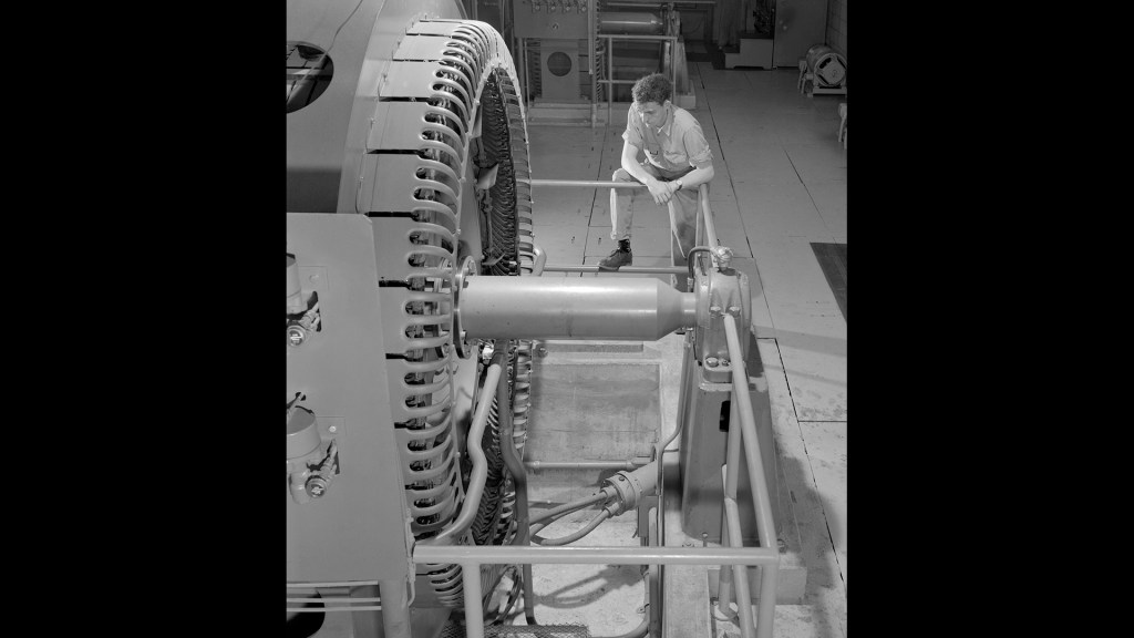 Technician with Compressor in Exhauster Building Addition