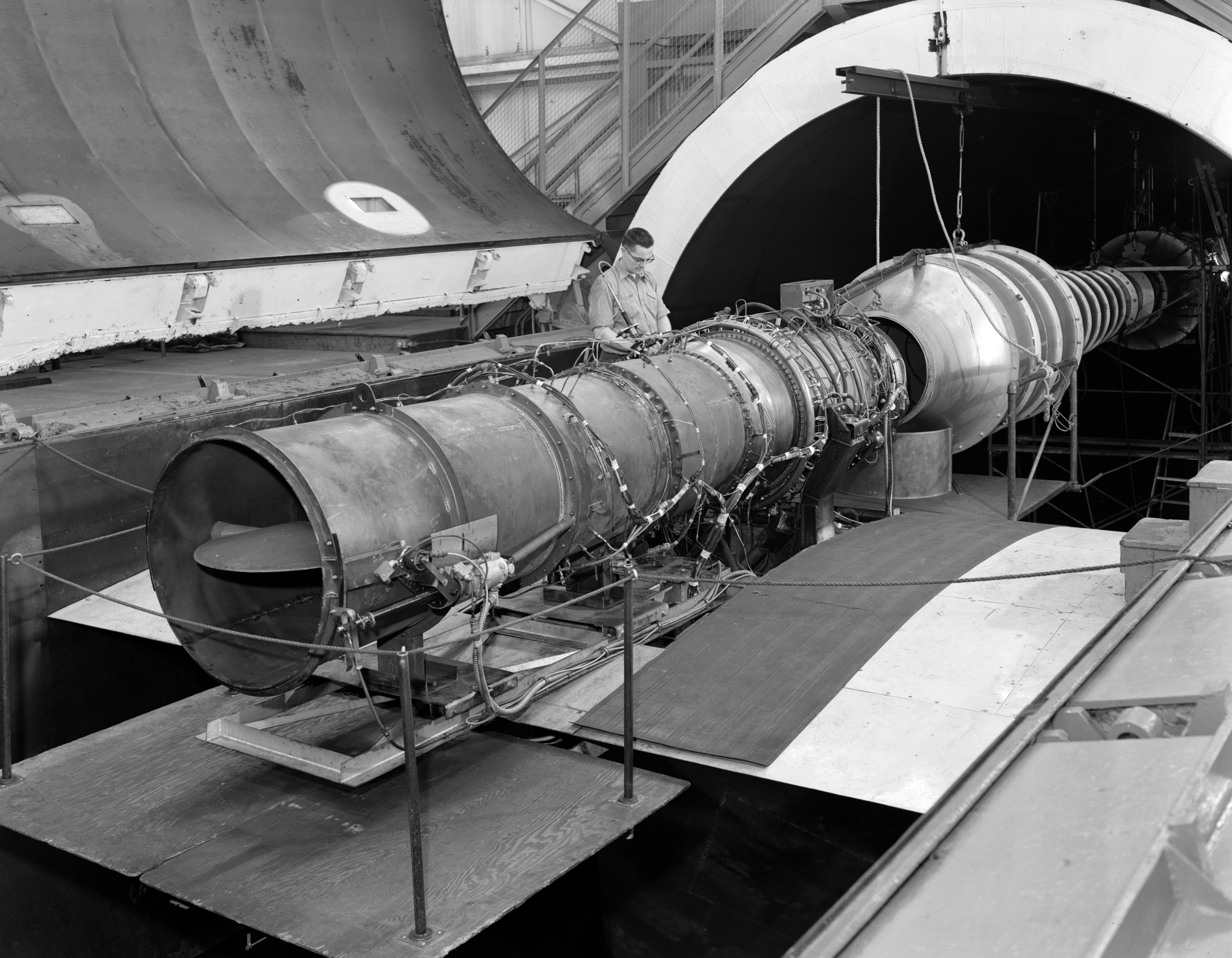 Mechanics work on J65 engine in AWT test section