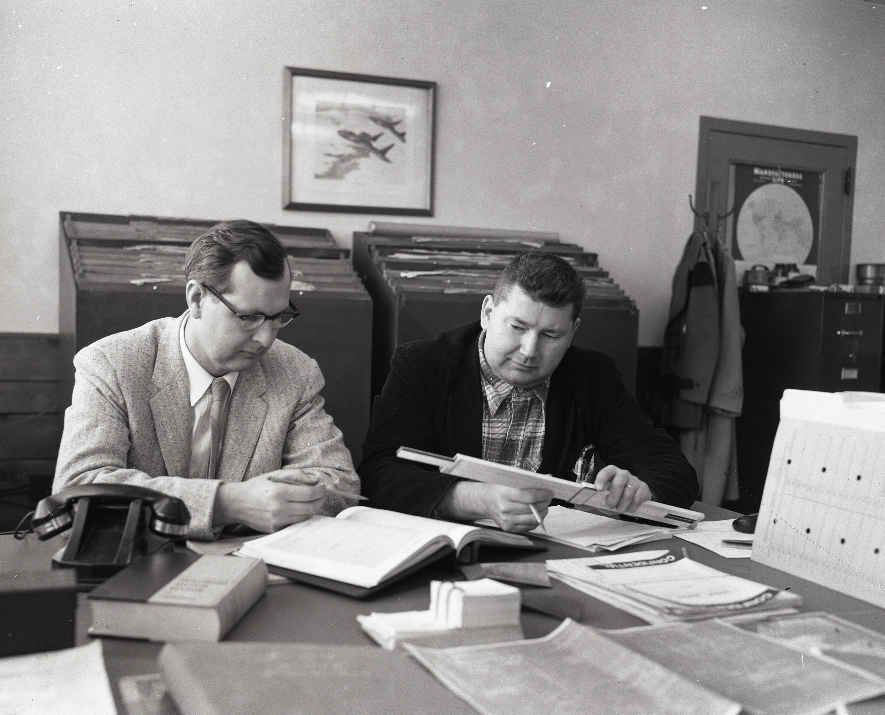 Two researchers at desk in AWT office