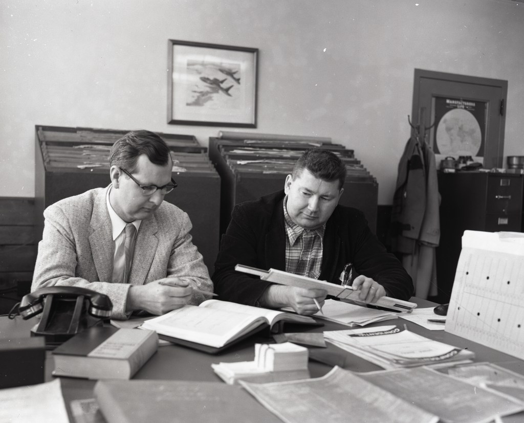 Two researchers at desk in AWT office