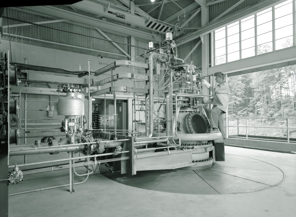 Mechanic working on RETF test stand.