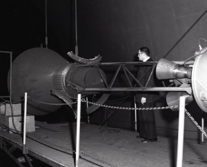 Researcher examines setup for Mercury capsule escape rocket test
