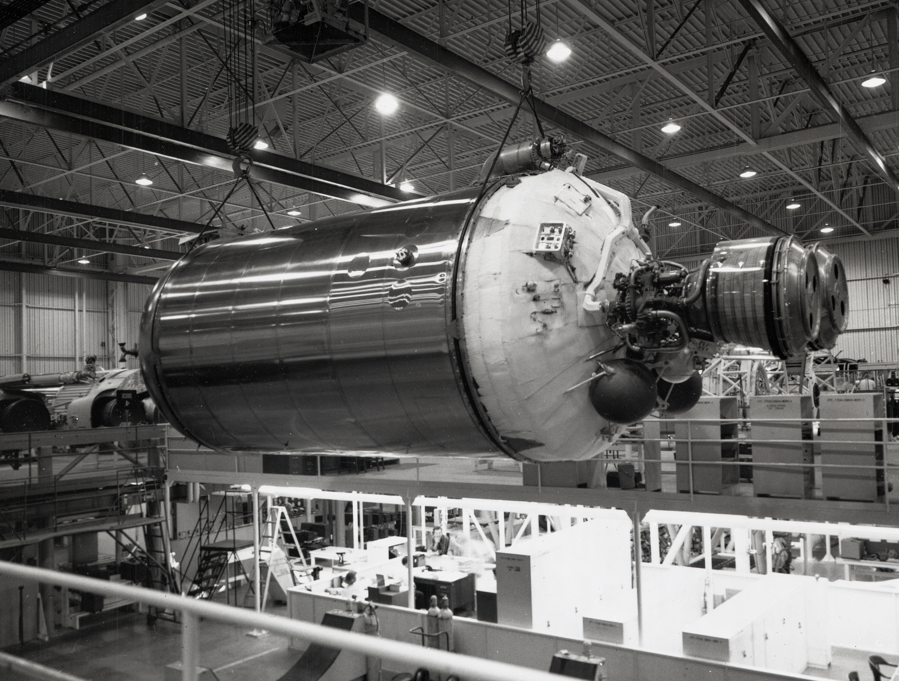 Centaur lifted horizontally by crane in factory