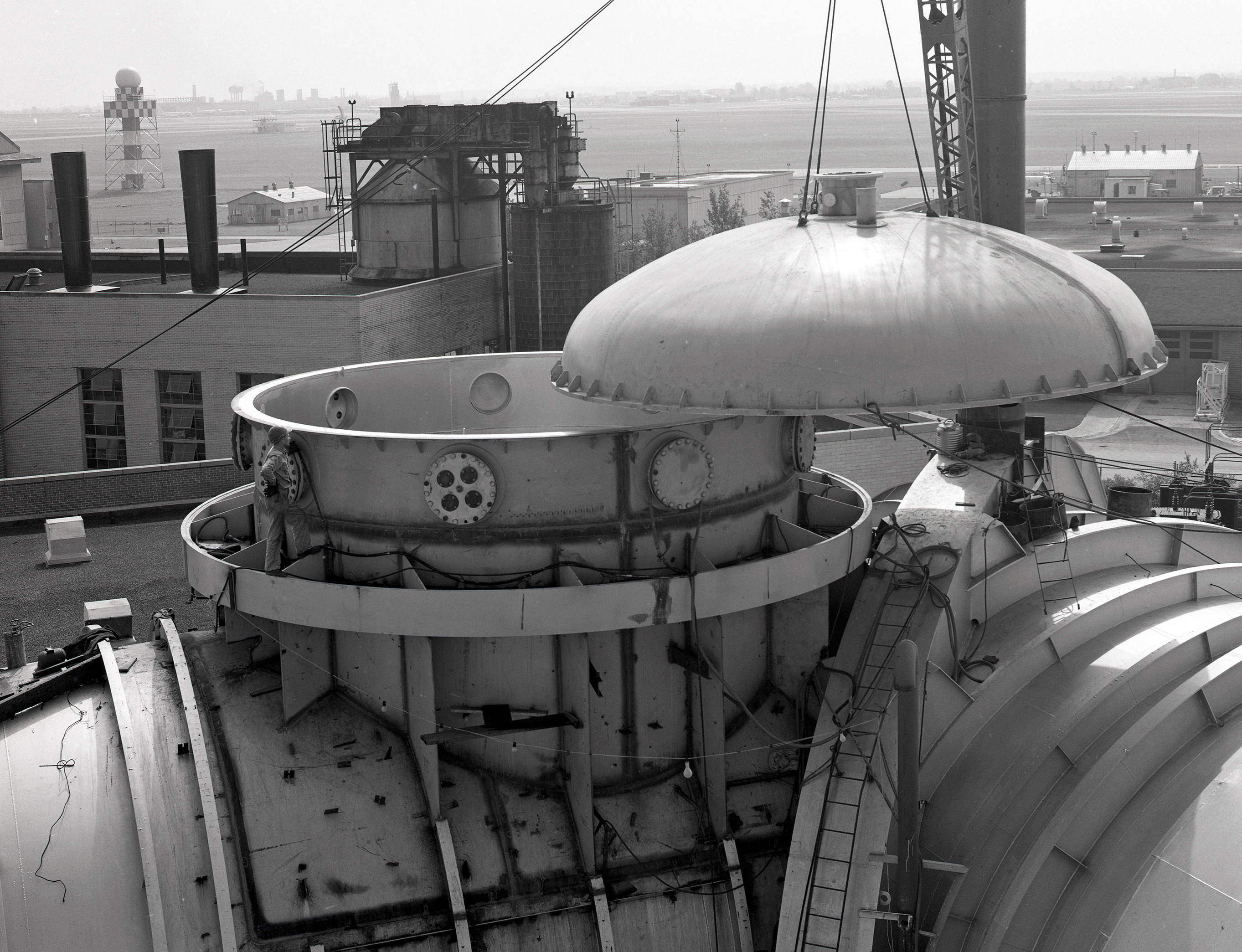 Crane lifts cap off the top of SPC No. 1 dome
