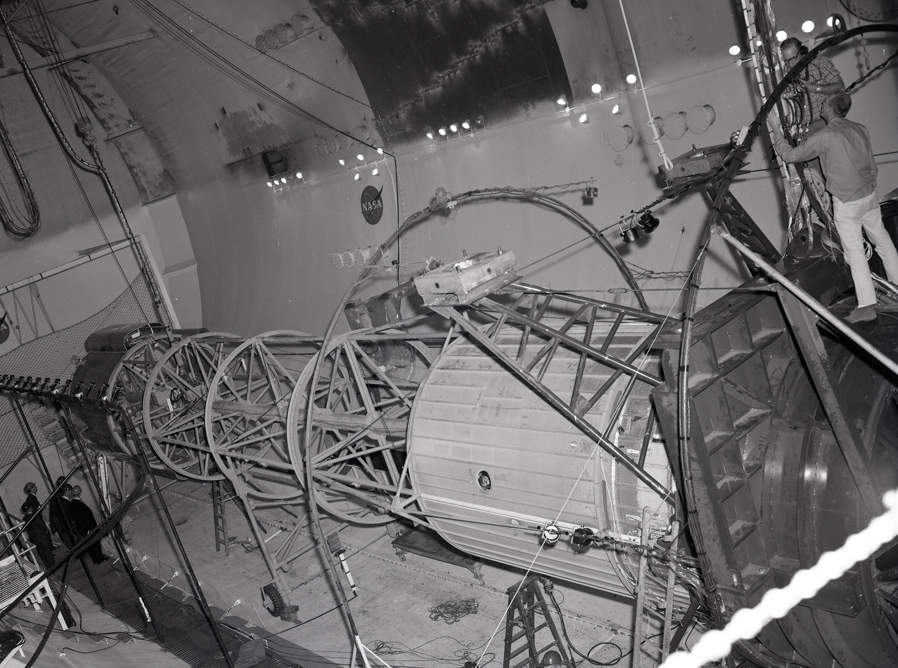 Engineers examine tubular Atlas-Centaur setup inside SPC No. 2