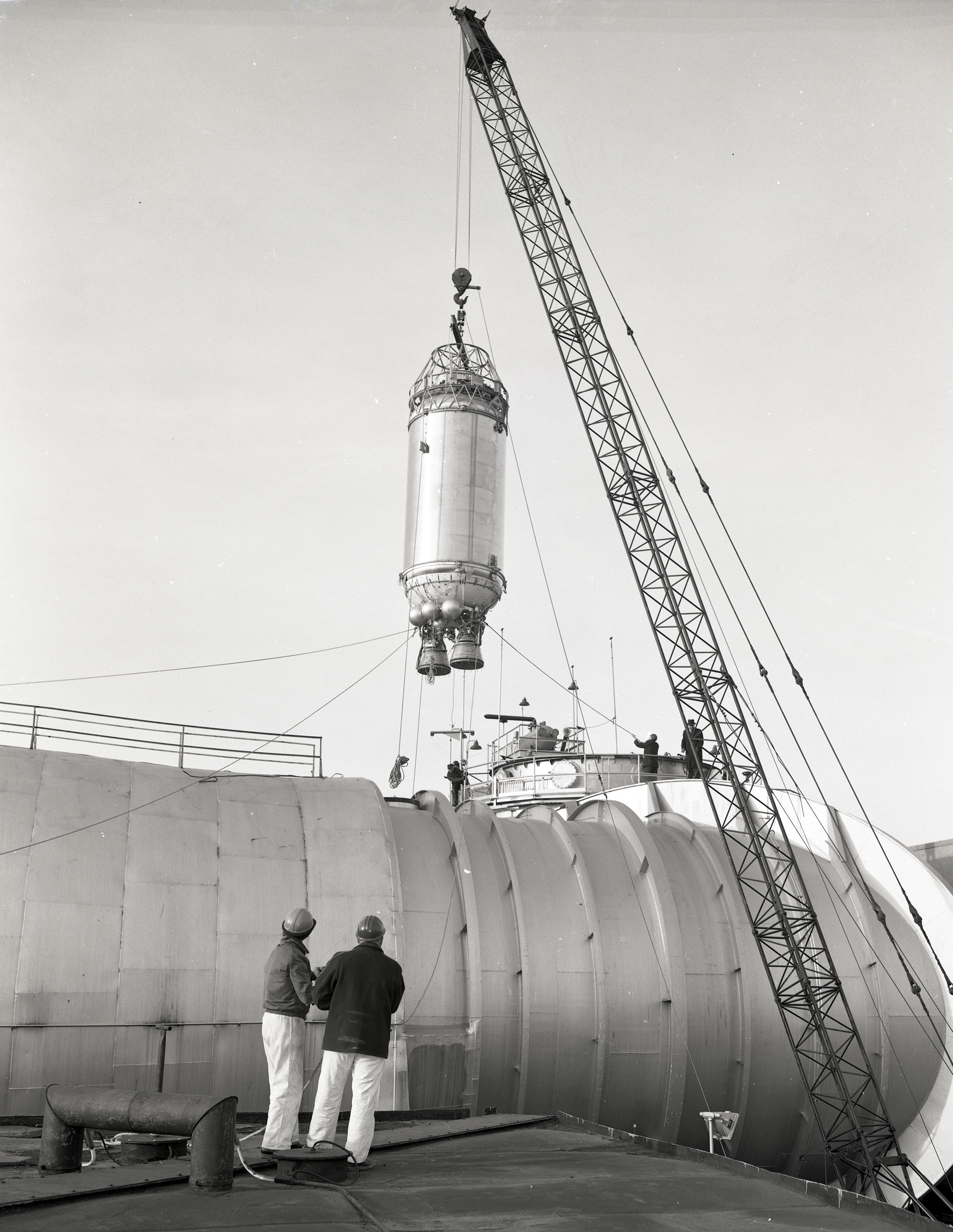 Crane lowering a Centaur rocket into the Space Power Chamber No.1