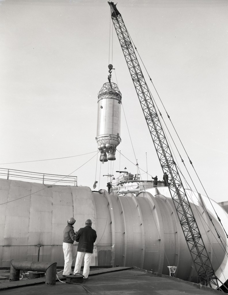 Crane lowering a Centaur rocket into the Space Power Chamber No.1