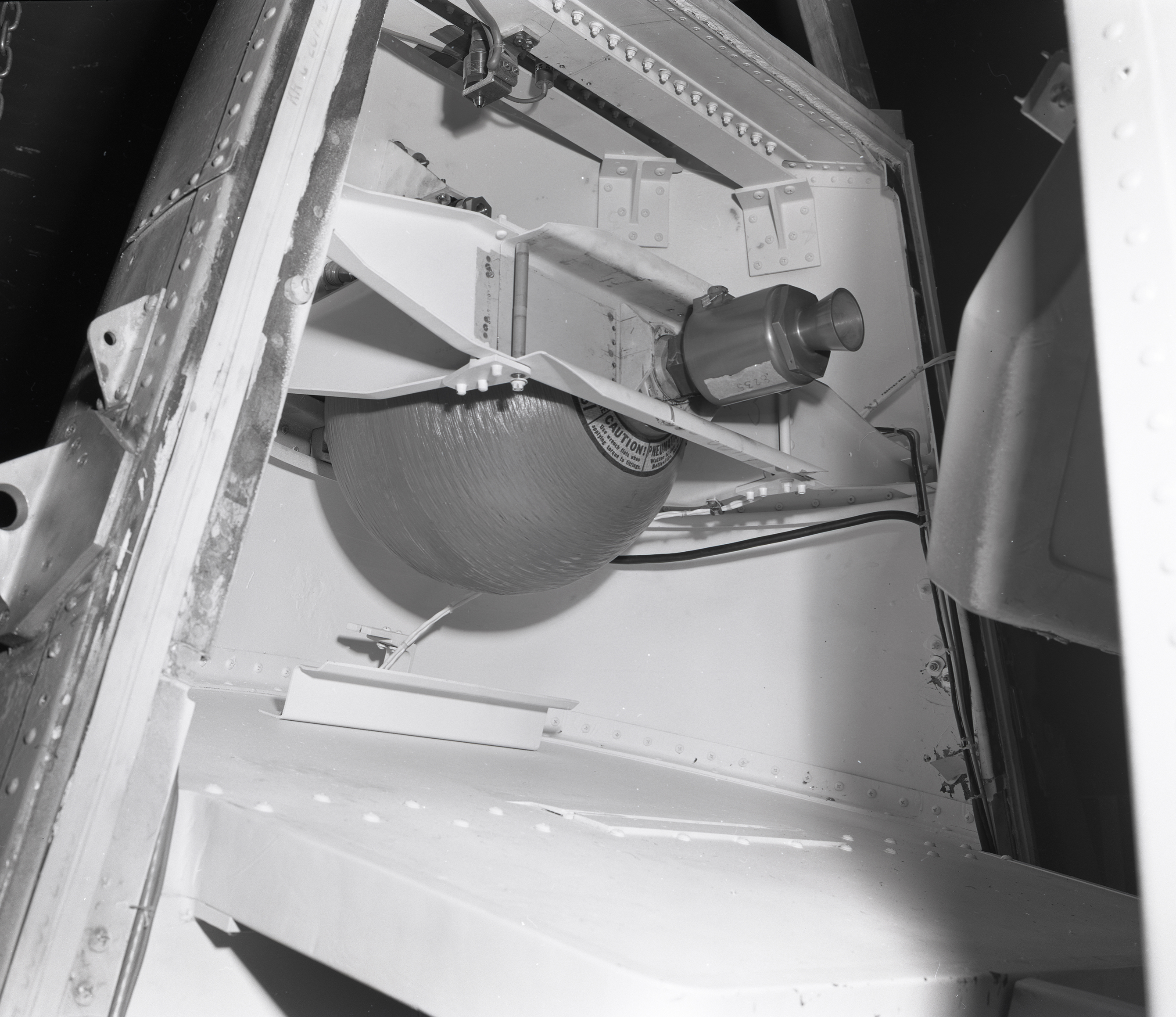 Thruster bottle and nozzle in the tip of the Surveyor nose cone