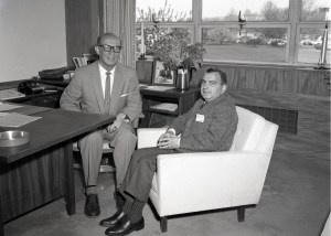 Two men sitting in office.