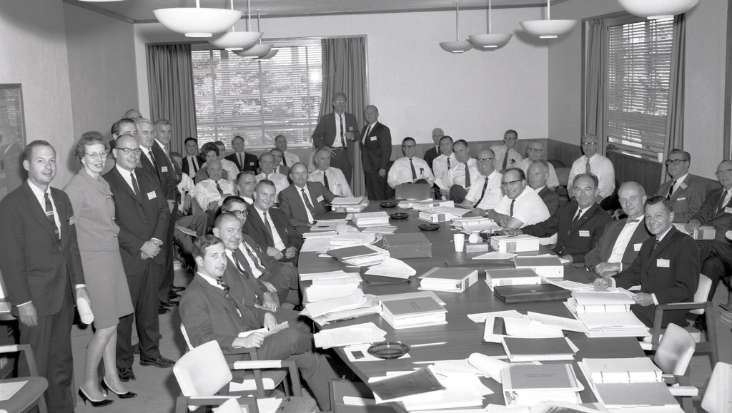 Large group of people in conference room.