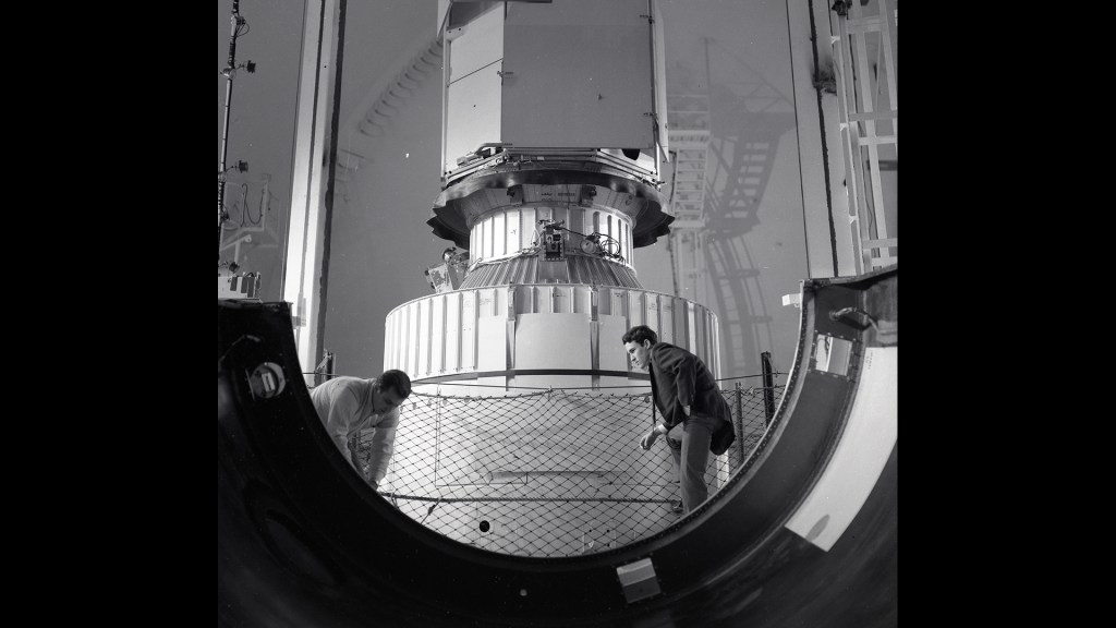 Lewis researchers examine the base of the OAO-2 nose fairing after it was jettisoned in SPC No. 2