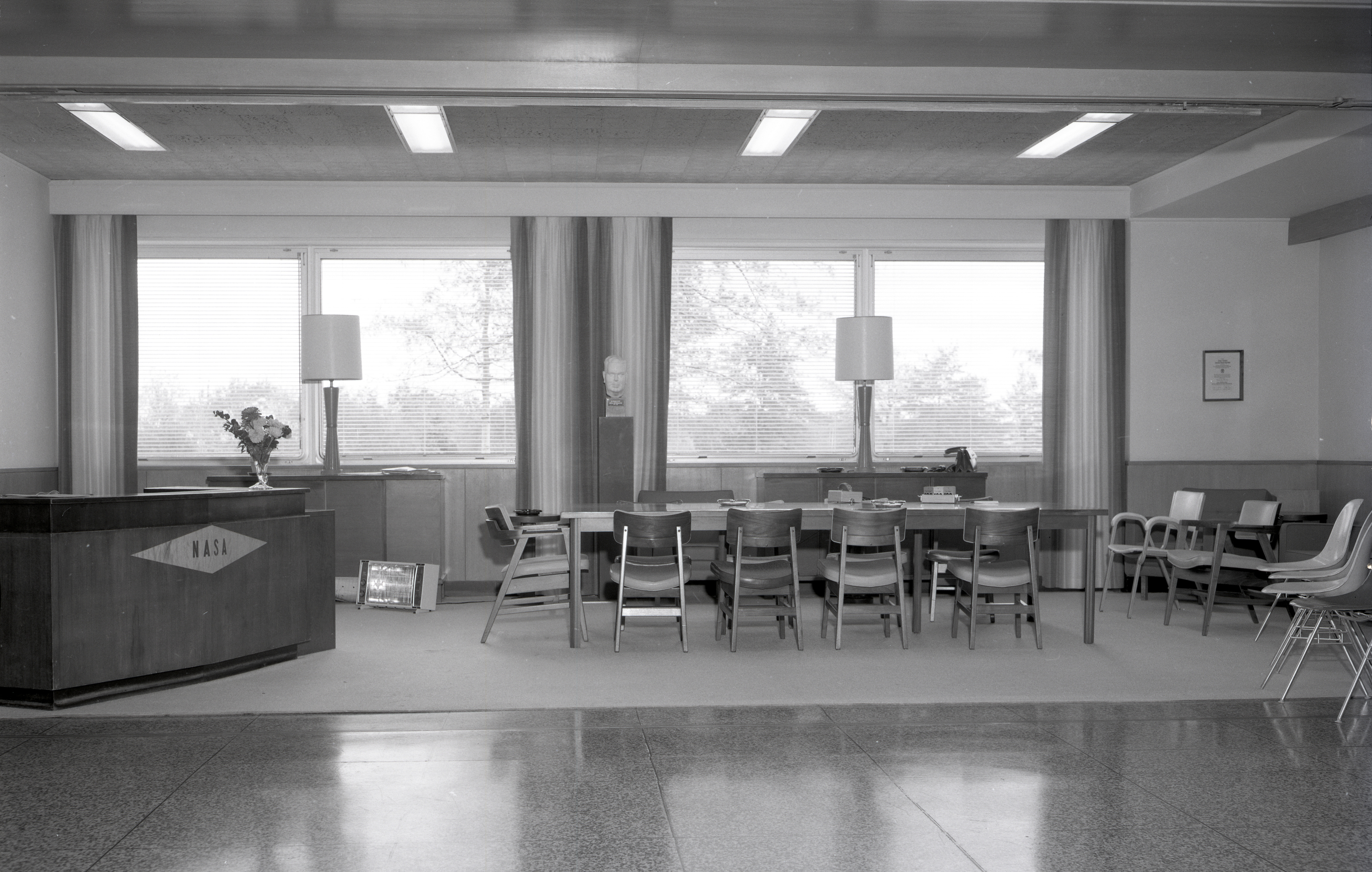 Empty meeting room with reception desk.