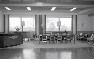 Empty meeting room with reception desk.