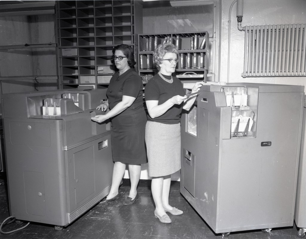 Two women with equipment.
