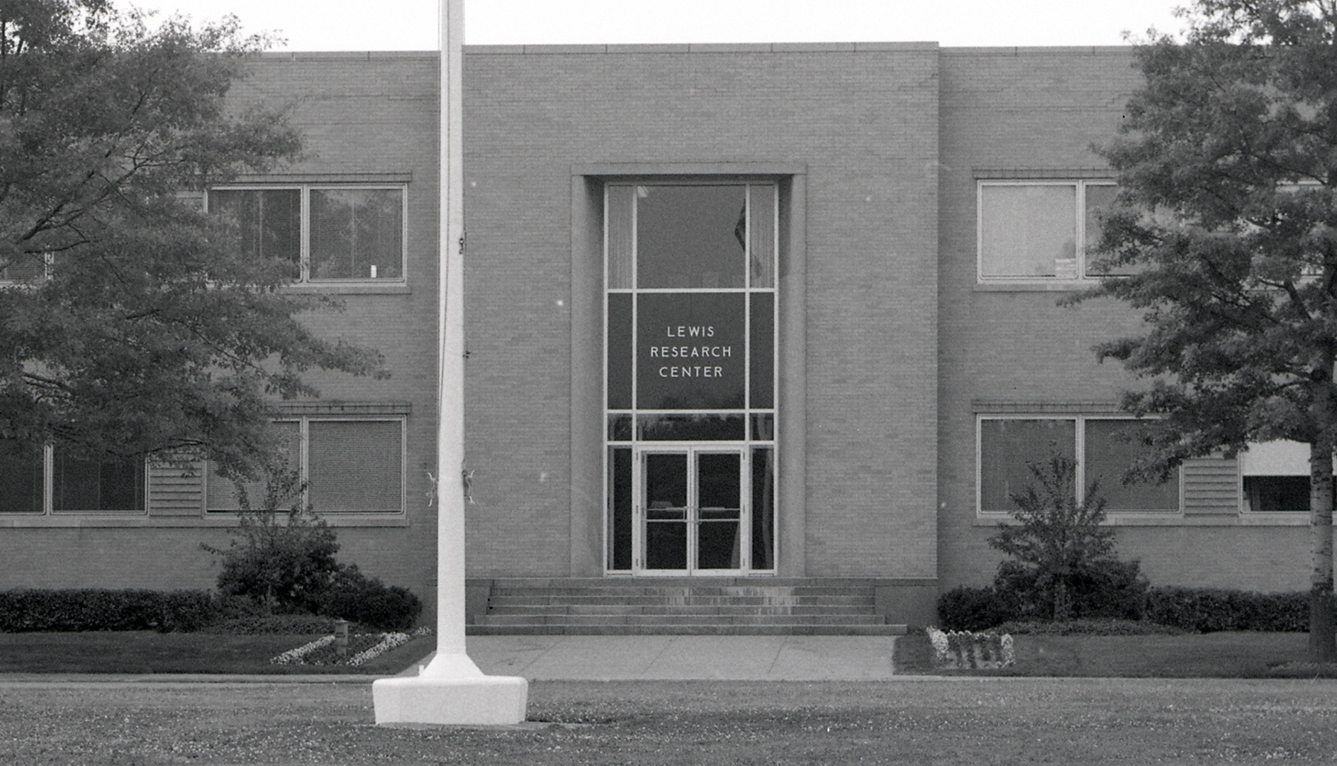 View of main entrance to brick building.