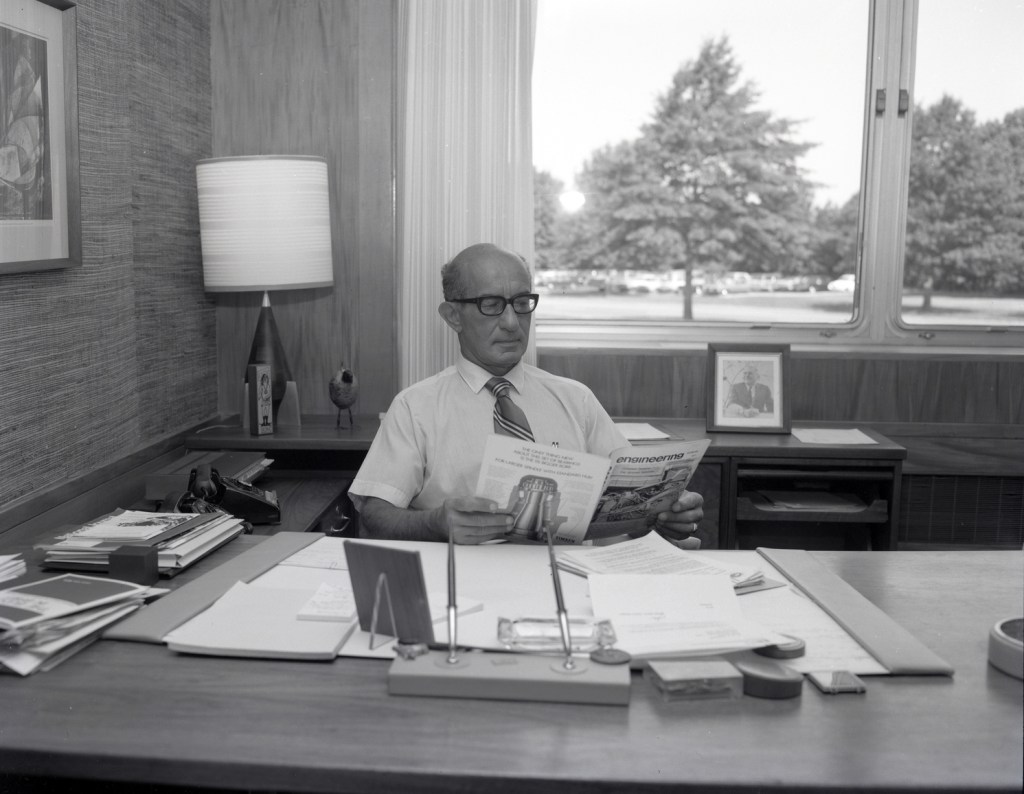 Man sitting at desk.