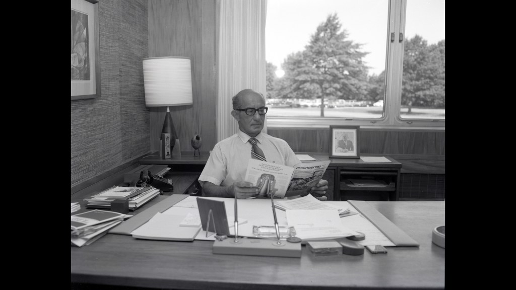 Man sitting at desk.