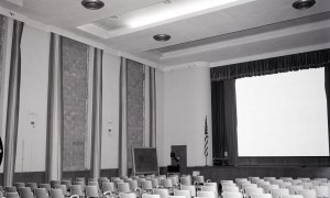 Empty auditorium with bricked-up windows.