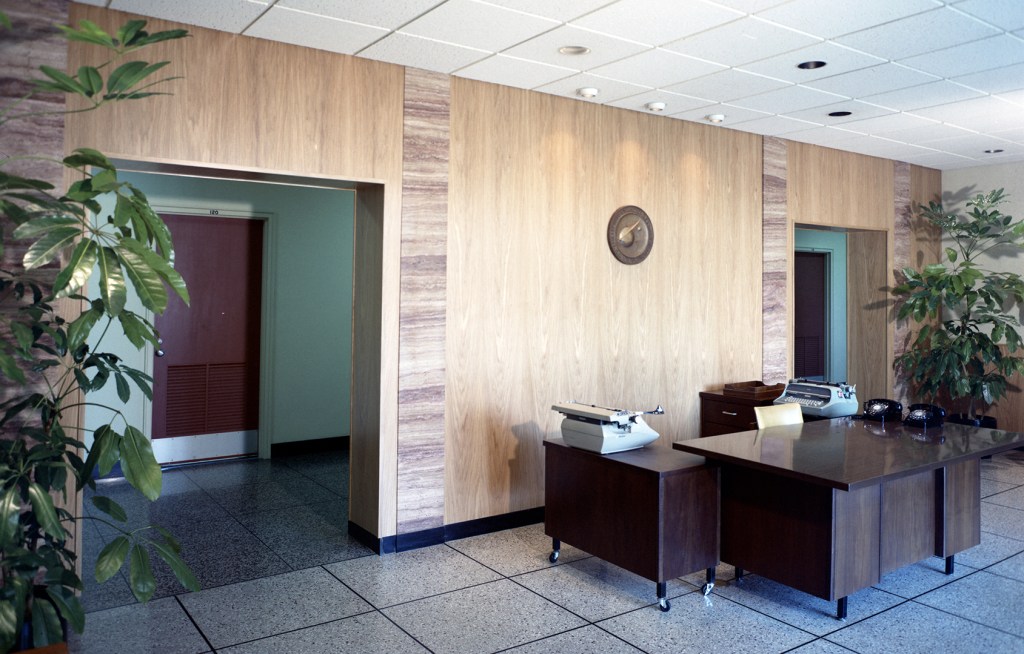 Wood-paneled lobby wall.
