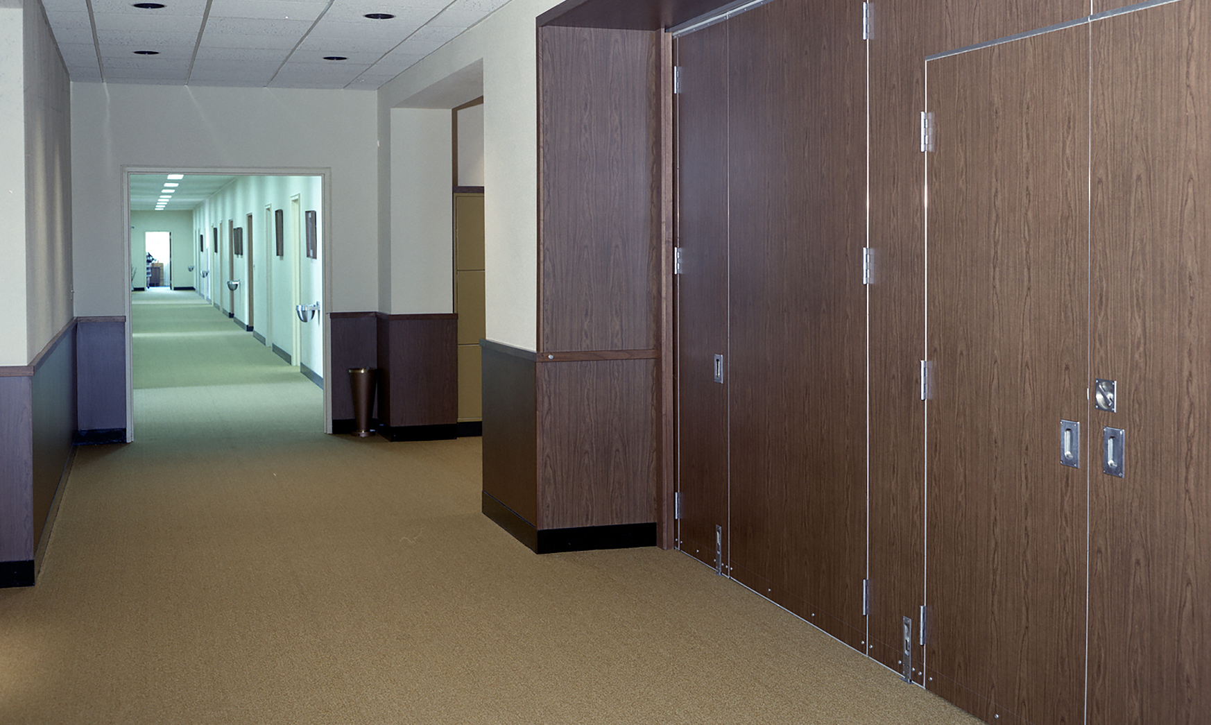 View down hallway in office building.