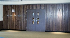 Inlaid wood entrance to auditorium.