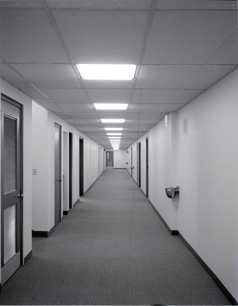 View down basement corridor.