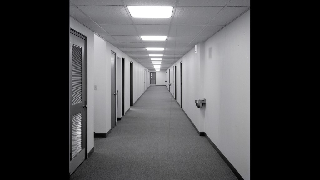 View down basement corridor.