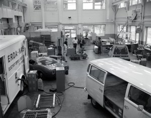 Shop area with various vehicles and equipment