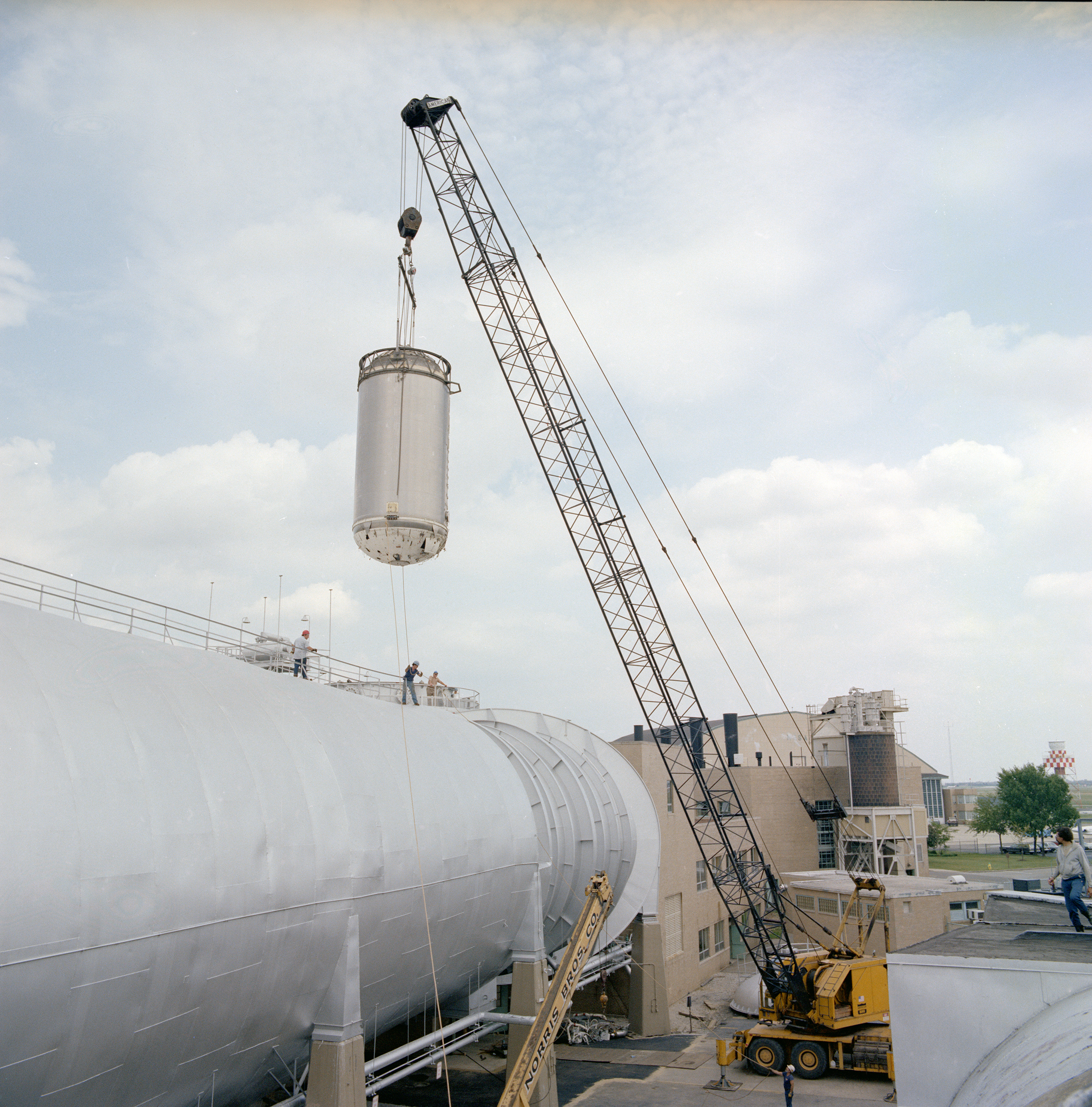 A crane lifts the Centaur stage from the SPC chamber