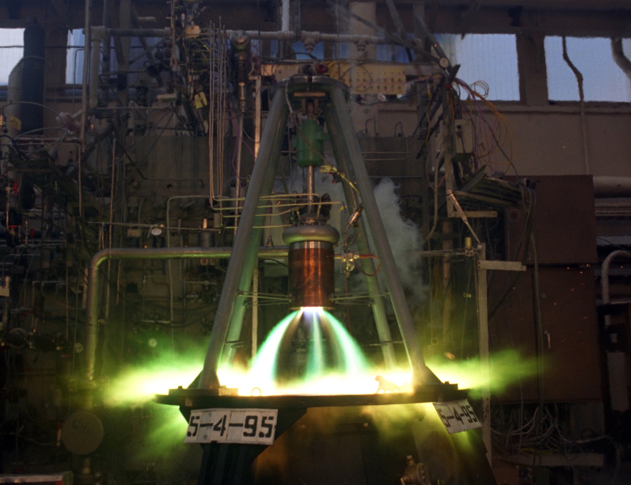Engine firing greenish flames in RETF stand.