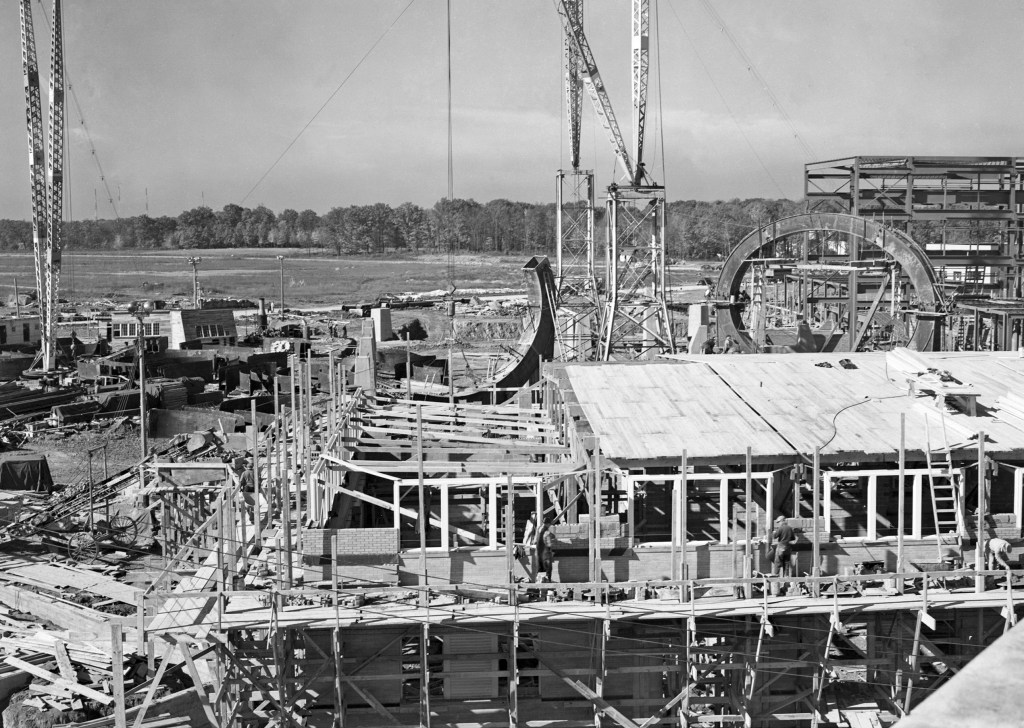 View of AERL construction with AWT rings in background.