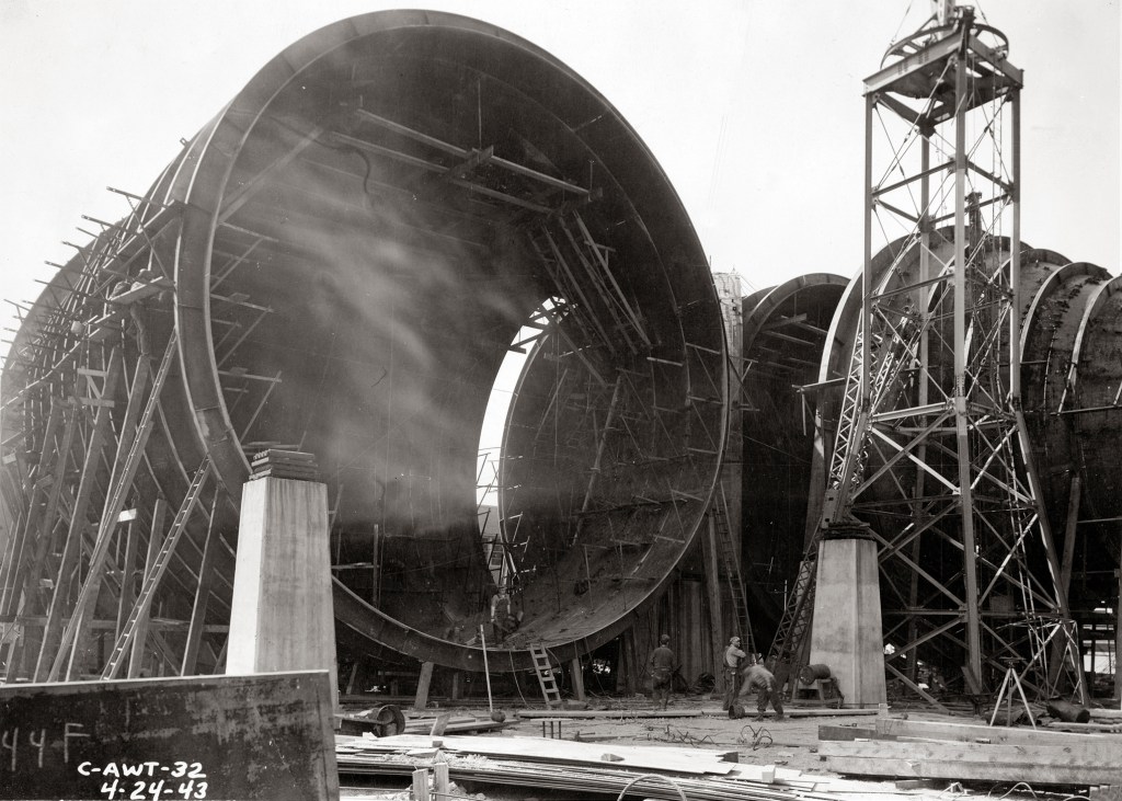 Half-built tunnel shell under construction.
