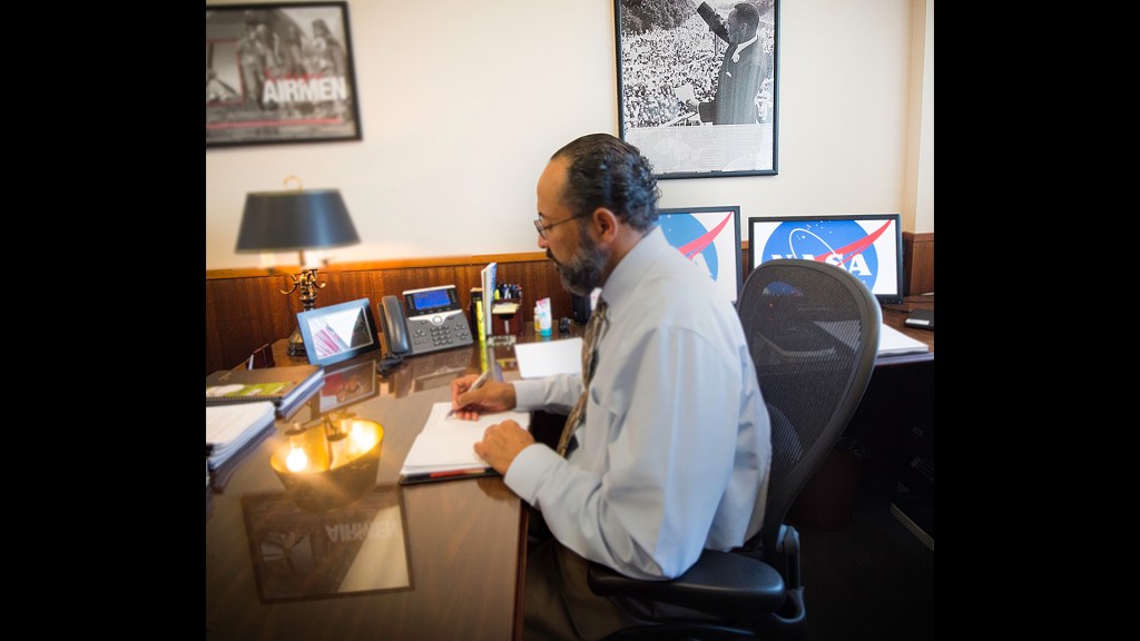 Man sitting at desk.