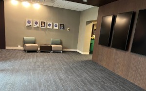 Empty lobby with hanging video screens.
