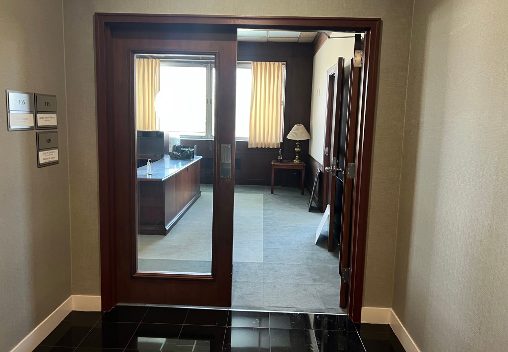 Glass doors leading into office.